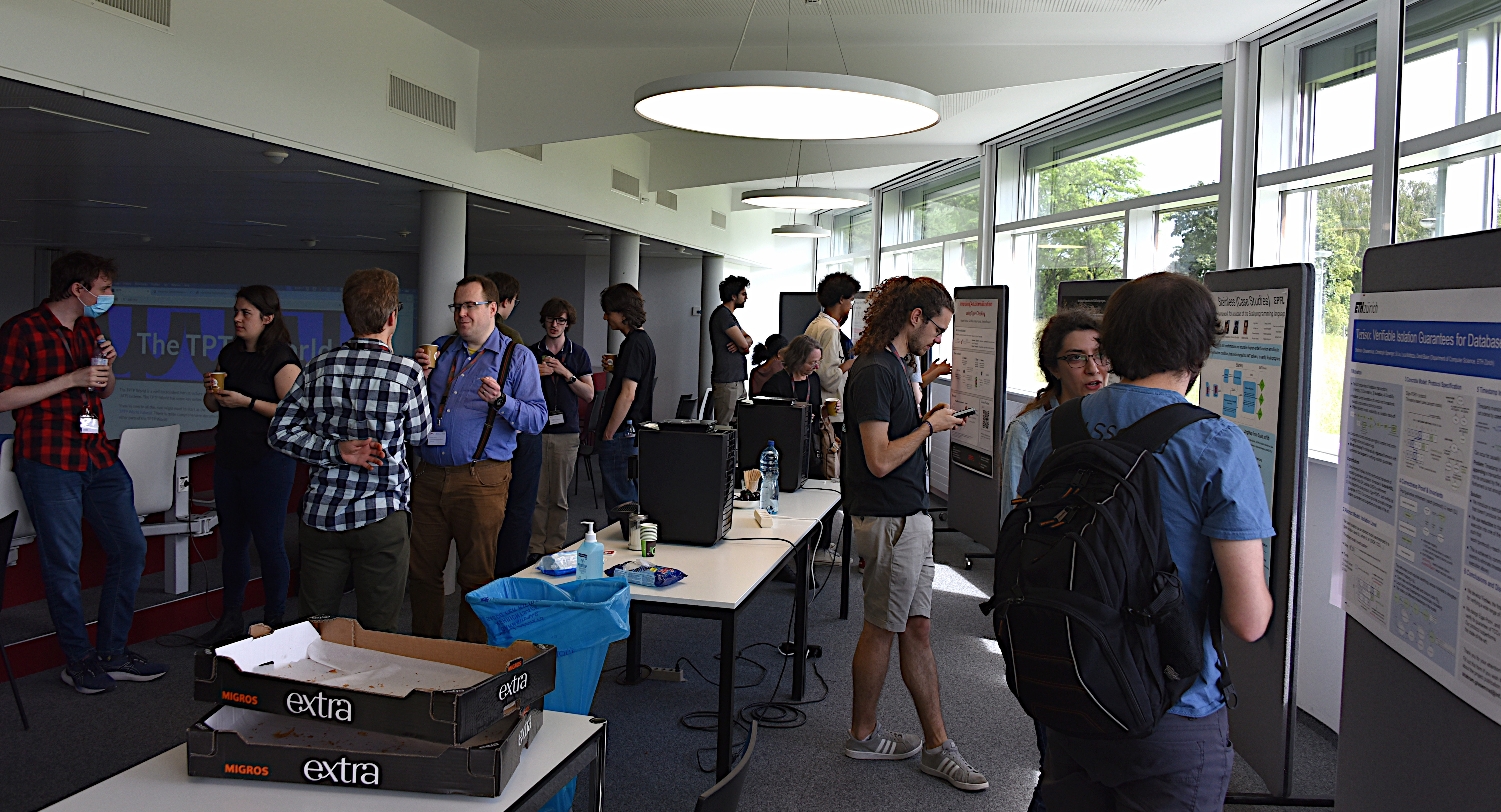 Students presenting posters during a coffee break.